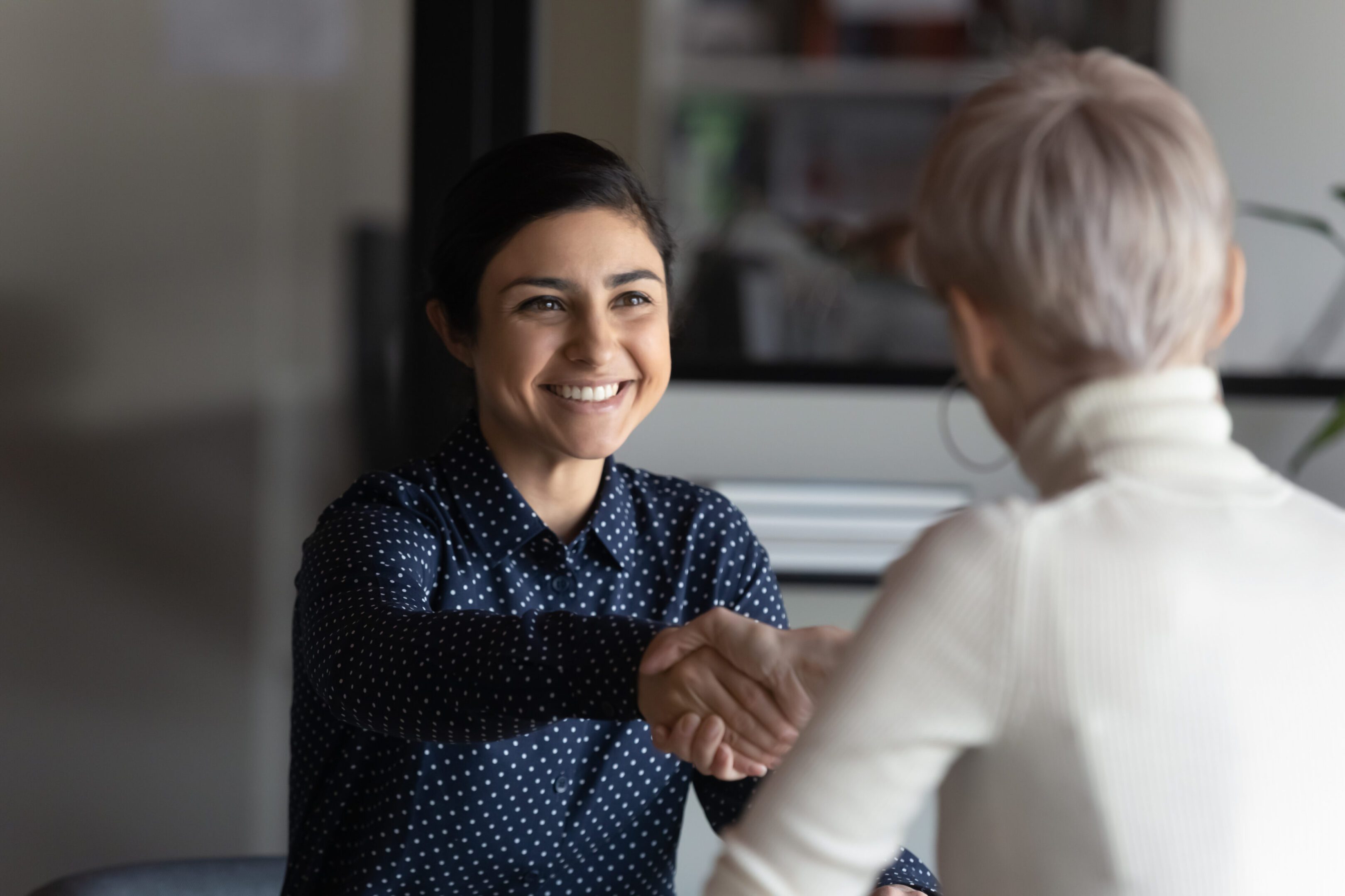 Successful manager making deal with partner shake hands express respect Happy employer HR manager shaking hands with indian job seeker welcoming vacancy applicant. Successful manager making deal with partner, good positive first impression, start business meeting concept