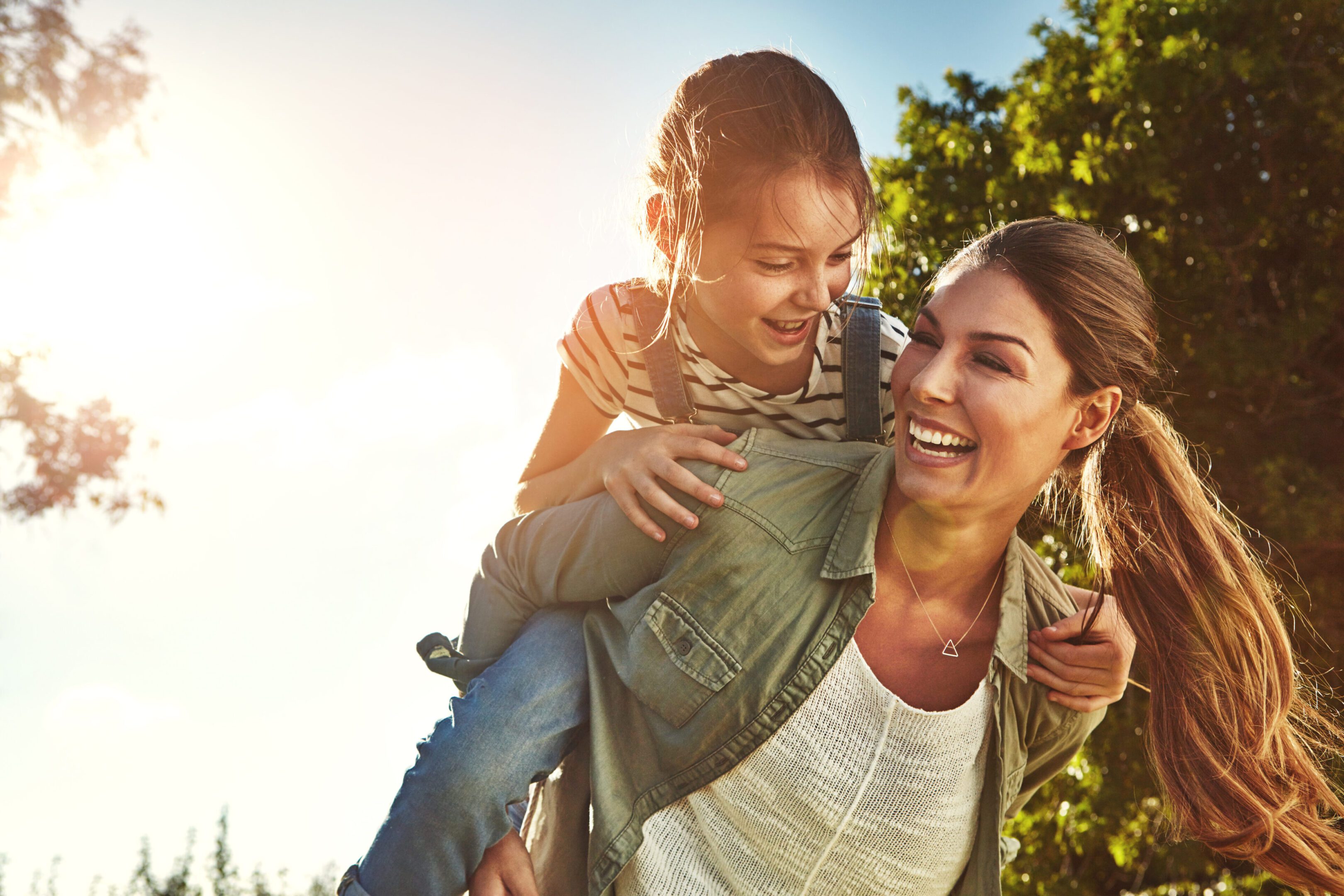Sharing good times on a golden afternoon Shot of a mother and her daughter bonding together outdoors